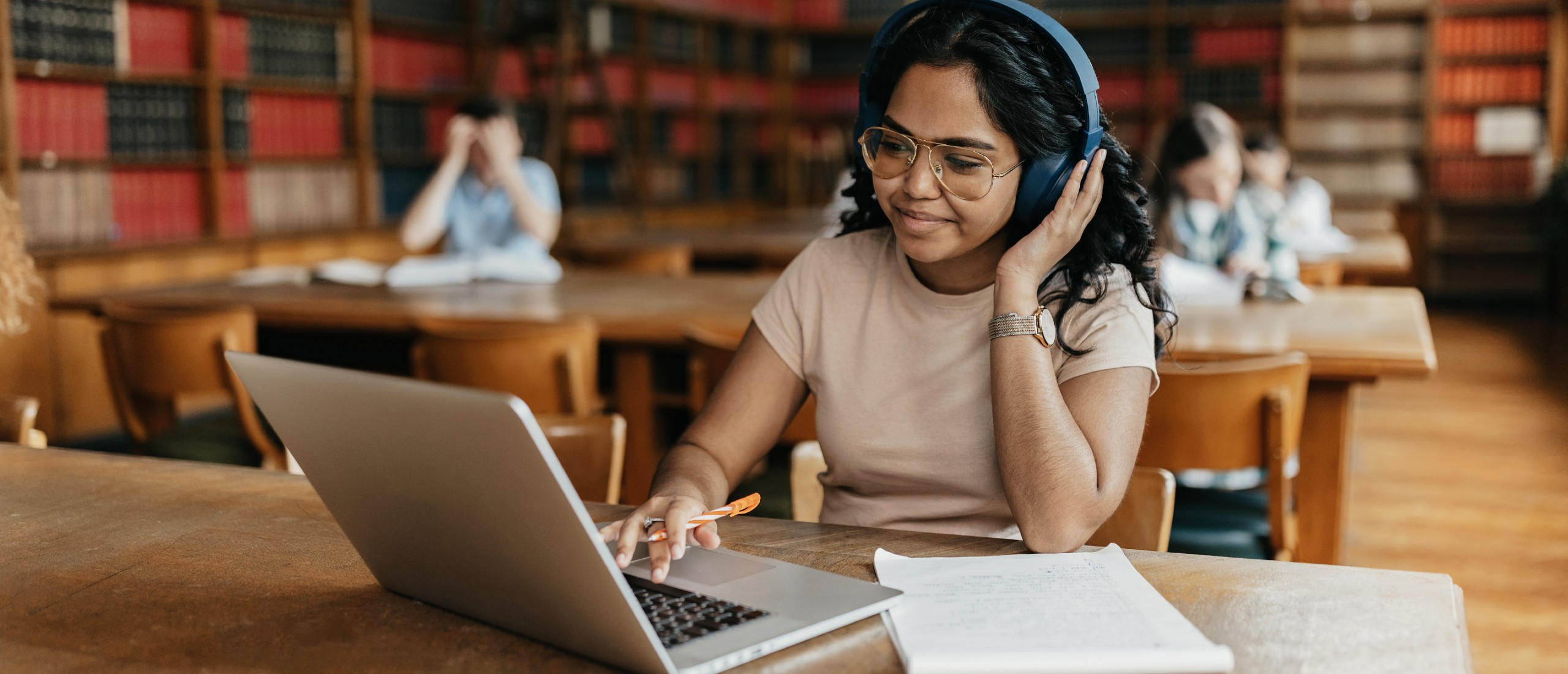 A college student works on her laptop